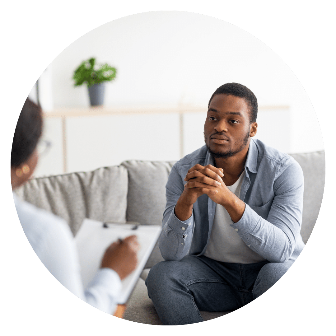 A male BIPOC therapist with a mentor that is helping them navigate their career path and hurdles.