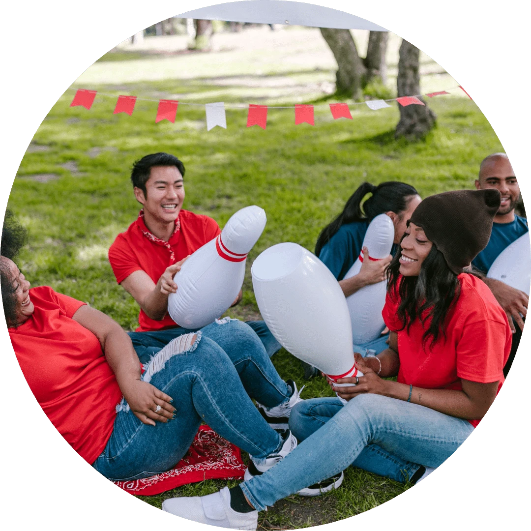 A group of diverse team members from an organization, engaging in team building activities