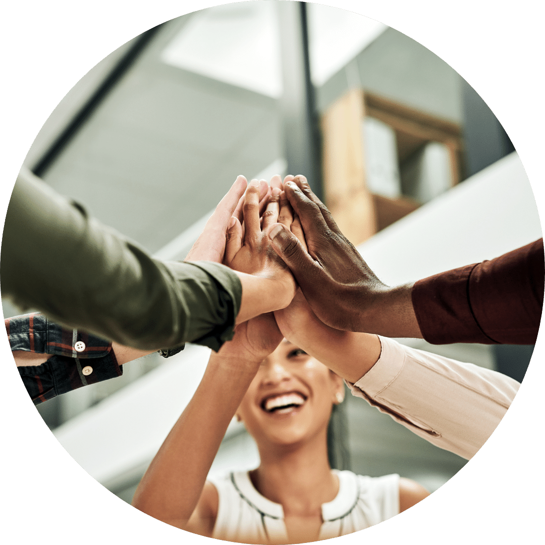 Hands coming together for a hearty cheer with a woman smiling